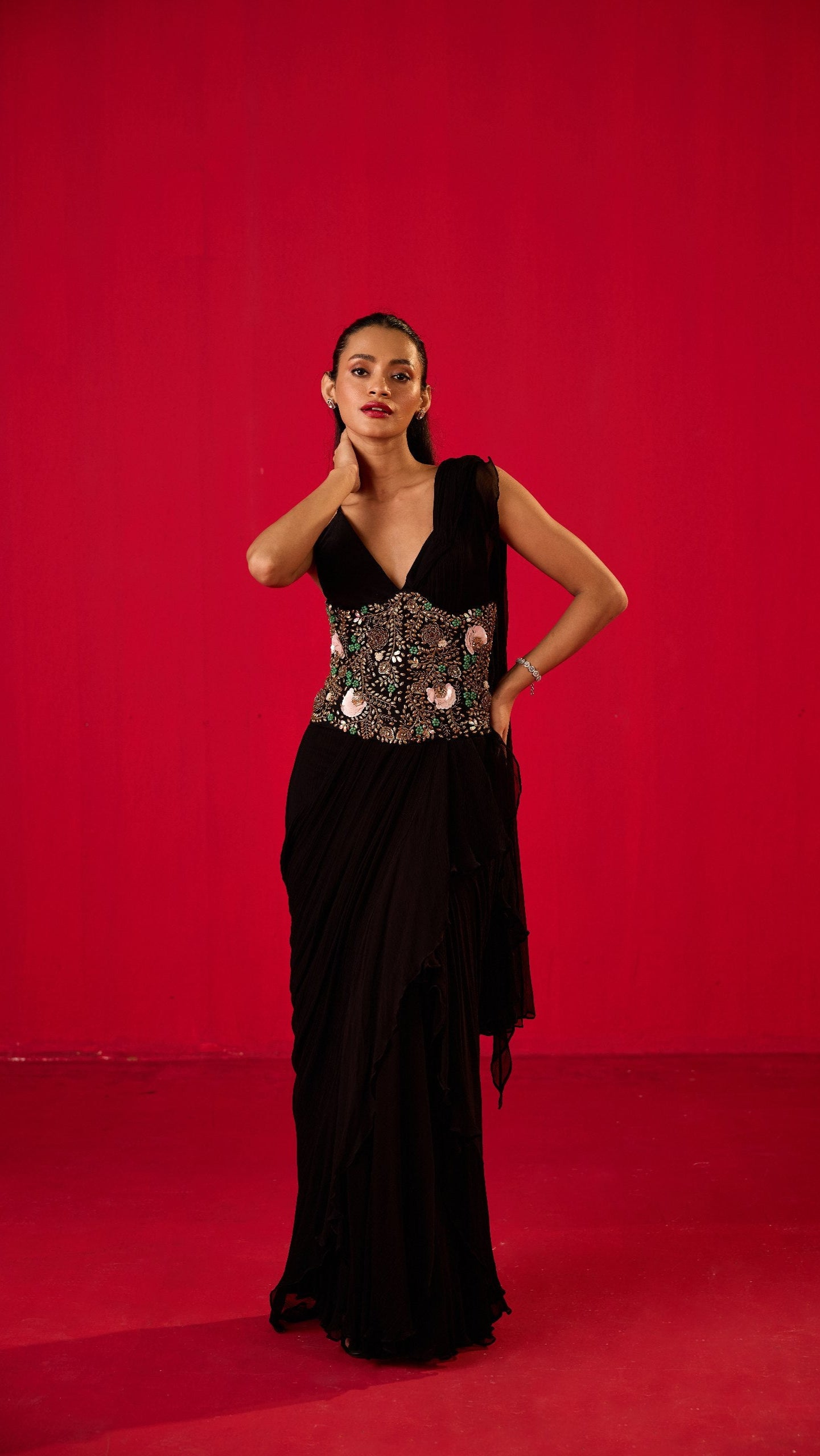 BLACK GEORGETTE RUFFLED SAREE PLAIN BRALET WITH EMB CORSET BELT
