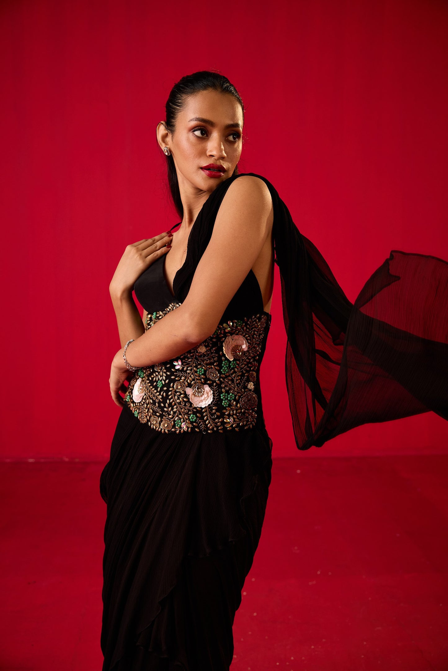 BLACK GEORGETTE RUFFLED SAREE PLAIN BRALET WITH EMB CORSET BELT