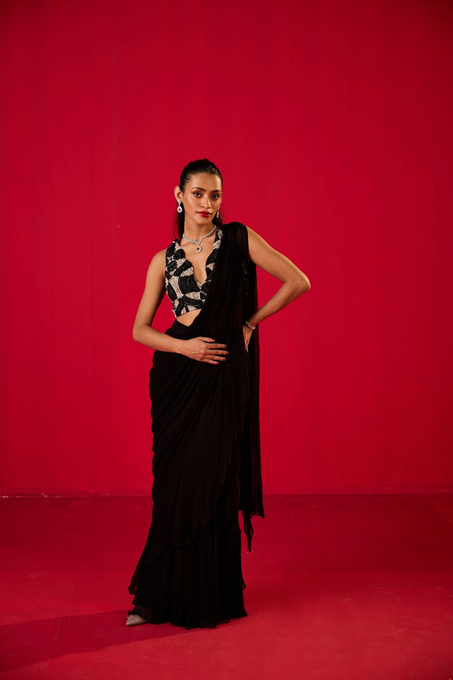 BLACK PLAIN RUFFLED STITCHED SAREE WITH EMBROIDERED BLOUSE