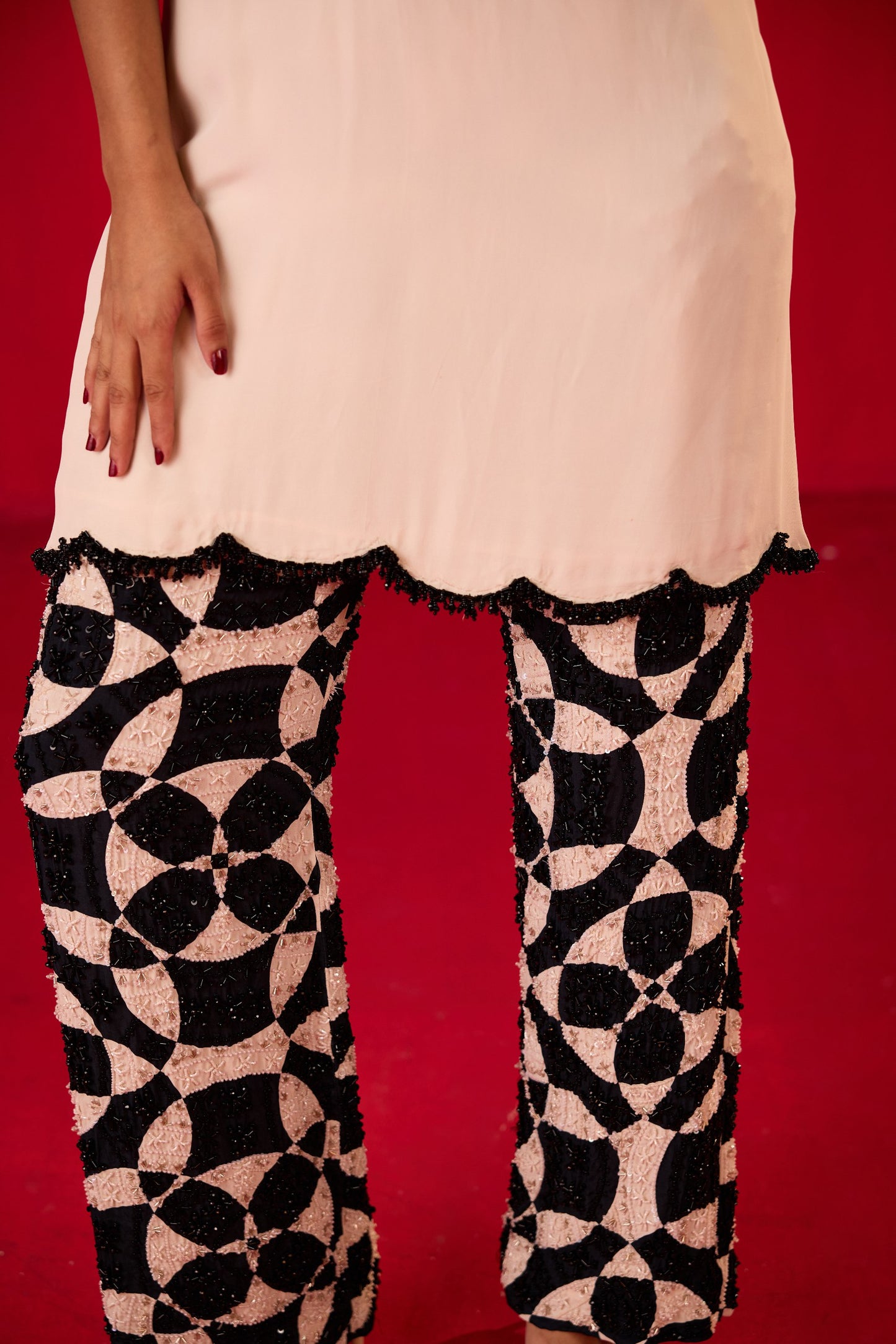 OFF WHITE CREPE TOP WITH PRINTED FULLY  EMBELLISHED TROUSERS